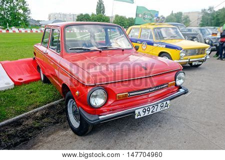 Kharkiv Ukraine - May 22 2016: Soviet retro car red ZAZ-968M is presented at the festival of vintage cars Kharkiv Retro Rally - 2016 in Kharkiv Ukraine on May 22 2016