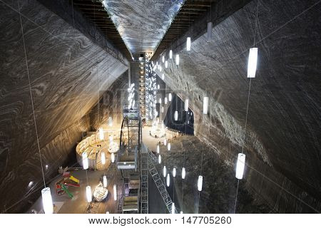 TURDA, ROMANIA - SEPTEMBER 15, 2016. Underground salt mine in Turda ,popular attraction for many tourists,Transylvania, Romania.