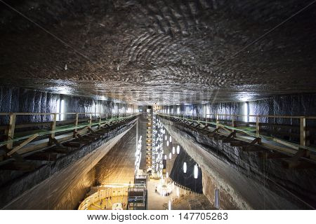 TURDA, ROMANIA - SEPTEMBER 15, 2016. Underground salt mine in Turda ,popular attraction for many tourists,Transylvania, Romania.