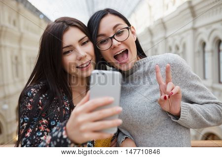 Girl Taking Selfie On Smart Mobile Phone With Dual Camera