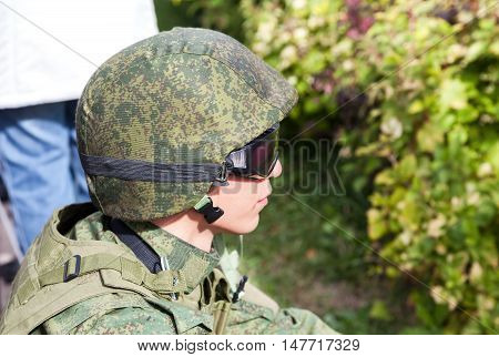 SAMARA RUSSIA - SEPTEMBER 11 2016: Unidentified member of military club in camouflage army uniform and helmet during military reenacting in Samara Russia