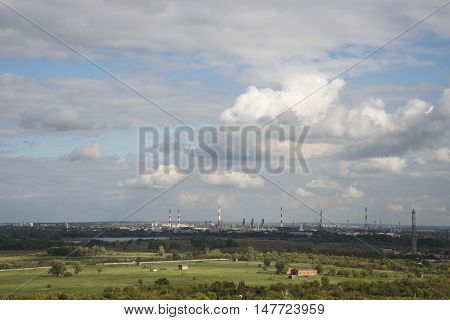 factory pipes on a background of nature. Summer landscape