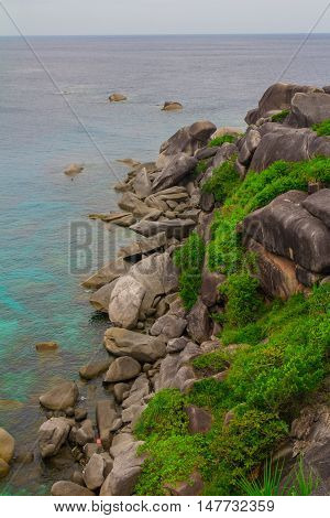 beautiful blue transparently sea waves stones view