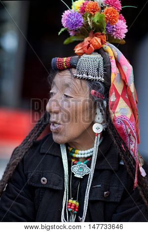 LEH, INDIA - JUNE 14, 2012: Drokpa woman in national clothes poses for a photo during Yuru Kabgyat festival.
