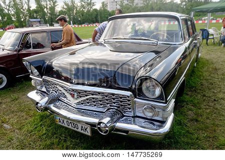 Kharkiv Ukraine - May 22 2016: Soviet retro car black GAZ-13 Chayka manufactured between 1959 and 1981 is presented at the festival of vintage cars Kharkiv Retro Rally - 2016 in Kharkiv Ukraine on May 22 2016