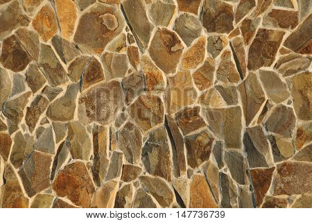 The wall of stone Rough masonry background texture