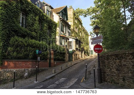 PARIS, FRANCE - MAY 12, 2015: Rue Cortot is one of the oldest and most picturesque streets of Montmartre.