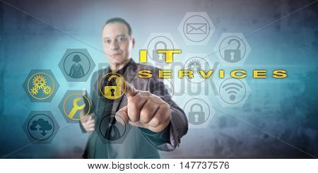 Friendly looking information technology manager is operating IT SERVICES tasks on a virtual screen. Business concept for professional IT services support management and service-oriented processes.
