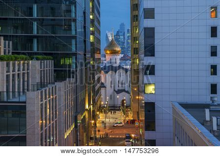 Temple of St. Nicholas in Tverskaya Zastava between office buildings in evening Moscow, Russia