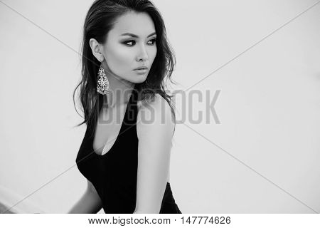 Professional photo shoot in desert. Beautiful sexy asian woman model in desert