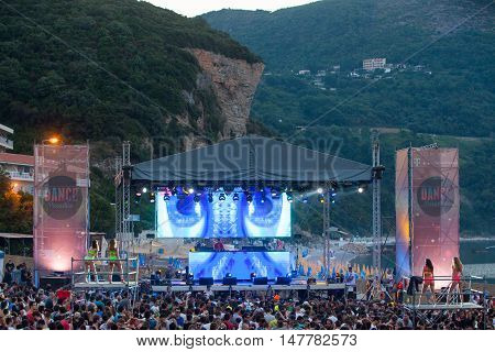BUDVA- JULY 18 : CROWD IN FRONT OF THE DANCE PARADISO STAGE MORNING SESSION AT BEACH AT SEA DANCE FESTIVAL 2015 MUSIC FESTIVAL JULY 18 2015 IN BUDVA JAZ BEACH MONTENEGRO