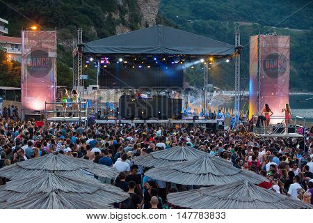BUDVA- JULY 18 : CROWD IN FRONT OF THE DANCE PARADISO STAGE MORNING SESSION AT BEACH AT SEA DANCE FESTIVAL 2015 MUSIC FESTIVAL JULY 18 2015 IN BUDVA JAZ BEACH MONTENEGRO
