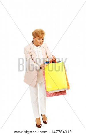 Happy business woman holging shopping bags