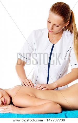 Woman having massage of body in the spa salon. Beauty treatment concept.