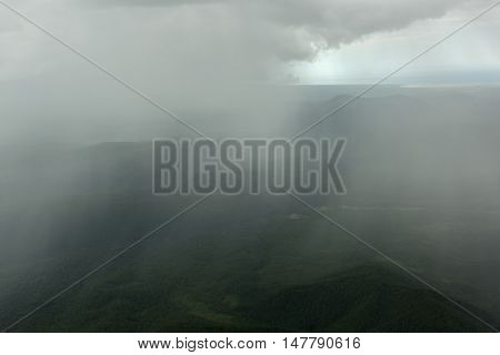 Rain in the Kronotsky Nature Reserve on Kamchatka Peninsula. View from helicopter.