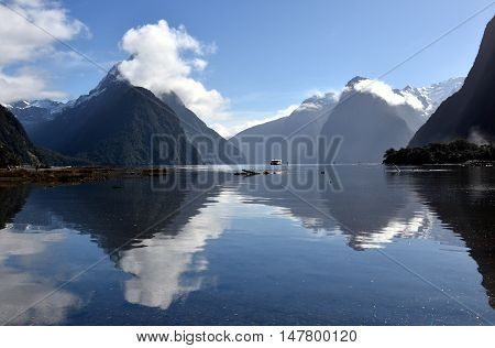 Milford Sound and Mitre Peak in Fiordland New Zealand water reflection. 8th wonder of the world.