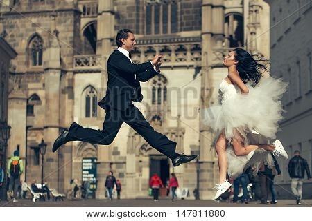 Wedding Happy Couple Jumping Near Castle