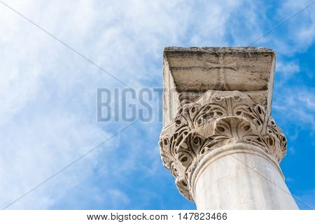 The column in the Ancient city Chersonese, on a bluesky background. Ruins of Basilica 1935 VI-X c. , Sevastopol, Crimea Russia. Free space for text.