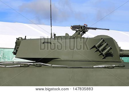 Rotating tower of the self-propelled gun consisting service of Russian army with 122 mm self-propelled howitzer 127 millimeter machine gun and grenade system