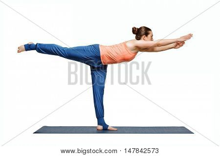 Beautiful sporty fit woman practices yoga asana Virabhadrasana 3 - warrior 3 pose isolated on white