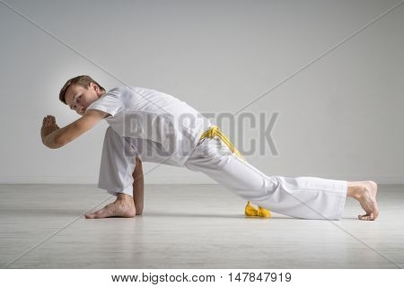 Man practicing capoeira , brazilian martial art.