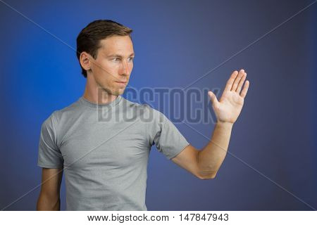 Man working with virtual touch screen.