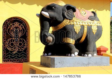Bright painted cement elephant at Kudupu Shri Ananthapadmanabhaswami Temple Mangalore Karnataka India Asia