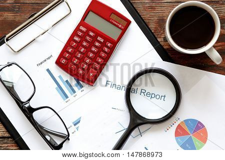 economist table with report and calculator top view