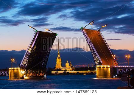 Open Palace Bridge and view of the Peter and Paul Fortress in St.Petersburg in white night