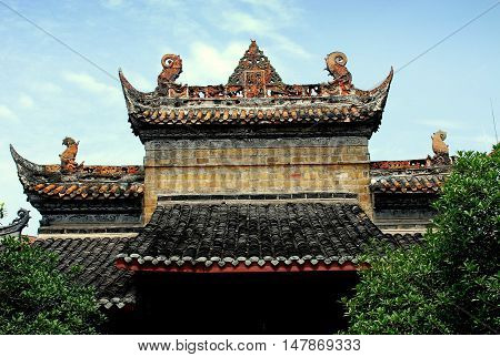 Deyang China - July 6 2007: Outer entry gate with carved dragons at the 13th century Deyang Confucian Temple