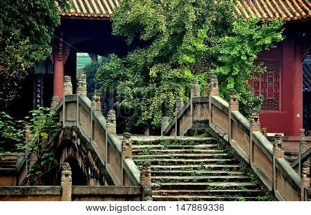 Deyang China - November 5 2009: One of three Pan Bridges with their stone stairs and lion balustrades spanning the Pan Pond and leading to the Dacheng Gate at historic 13th century Deyang Confucian Temple