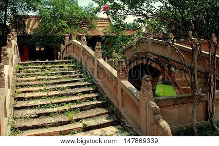 Deyang China - July 6 2007: Two of the stepped Pan Bridges leading to the 1849 Ji Gate at the 13th century Deyang Confucian Temple