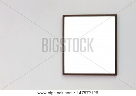 horizontal photo of photo frame on blank wall background copyspace.