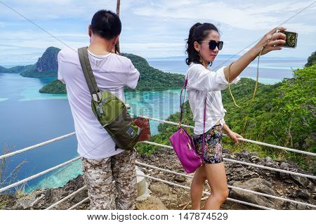 Semporna,Sabah-Sep 10,2016:Tourists enjoying amazing view from top of Bohey Dulang island Semporna,Sabah.The greatest tourist attraction of Semporna with bright blue water & rocky shore in the islands