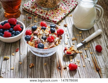 Healthy Coconut Granola with Nuts, Gogi Berry and Berries. Healthy breakfast. Selective focus.