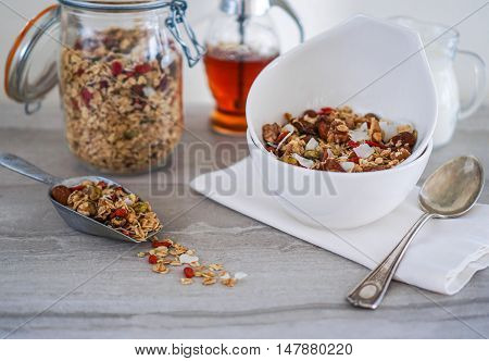 Healthy Coconut Granola with Nuts, Gogi Berry and Honey. Healthy breakfast. Selective focus.