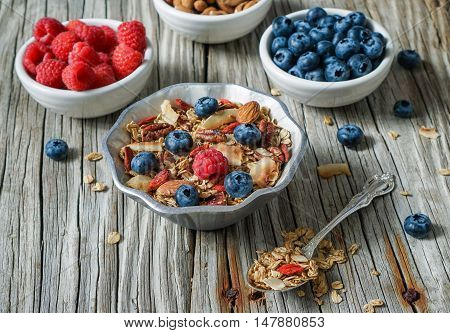 Healthy Coconut Granola with Nuts, Gogi Berry and Berries. Healthy breakfast. Selective focus.