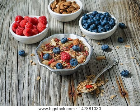 Healthy Coconut Granola with Nuts, Gogi Berry and Berries. Healthy breakfast. Selective focus.