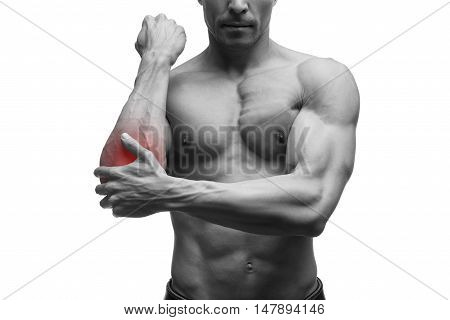 Pain in the elbow muscular male body isolated on white background with red dot black and white photography
