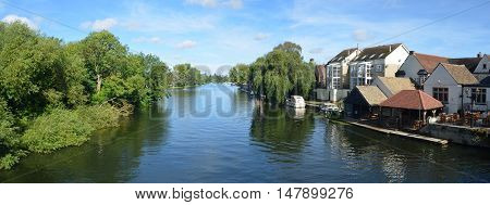 St Neots, Cambridgeshire, England - September 11, 2016: The river Ouse, Regatta meadows and riverside buildings at St Neots Cambridgeshire England.