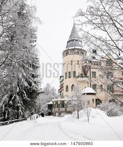 IMATRA, FINLAND - JANUARY 28, 2011: Hotel Rantasipi Imatran Valtionhotelli. Winter view.  Was built in 1903 and designed by the Art Nouveau castle.