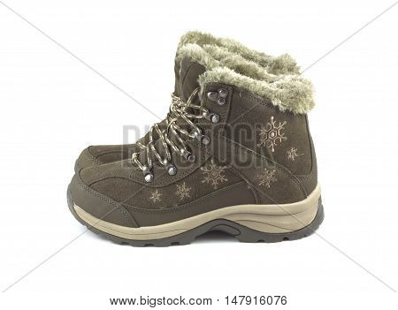 Two beautiful winter brown boots isolated on white side view closeup
