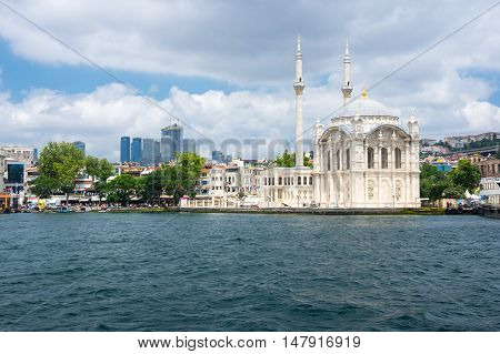 ISTANBUL TURKEY - JUNE 25 2015: Ortaköy Mosque (Grand Imperial Mosque of Sultan Abdulmecid) in Istanbul Turkey is situated at the waterside of the Ortakoy pier square one of the most popular locations on the Bosphorus