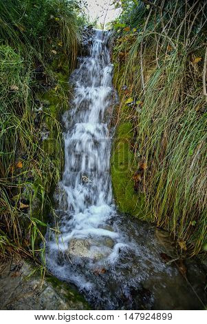 Autumn Landscape With Colorful Leaves, River And Reflections In Water