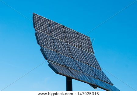 solar panel oon pole against clear blue sky