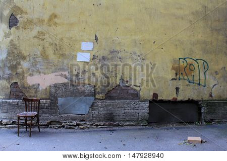 photo abstract art old wall on street with chair