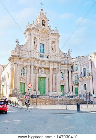 CATANIA ITALY - OCTOBER 10 2012: The white stone facade of Collegiate Church of Santa Maria dell'Elemosina the beautiful basilica in the city center on October 10 in Catania.