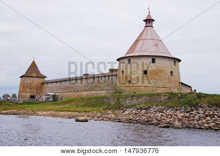 SHLISSELBURG RUSSIA - SEPTEMBER 2015: view from the excursion boat on the architectural and historical monument - the Oreshek fortress on the Walnut island at the source of the Neva.