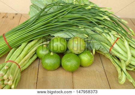 fresh green Lime Yardlong bean Leek and kale on wood floor