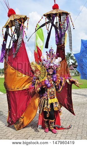 Tenggarong Indonesia - October 27th 2012: carnival with unique costumes on public roads within distance 4 km and is held every year in east borneo indonesia
